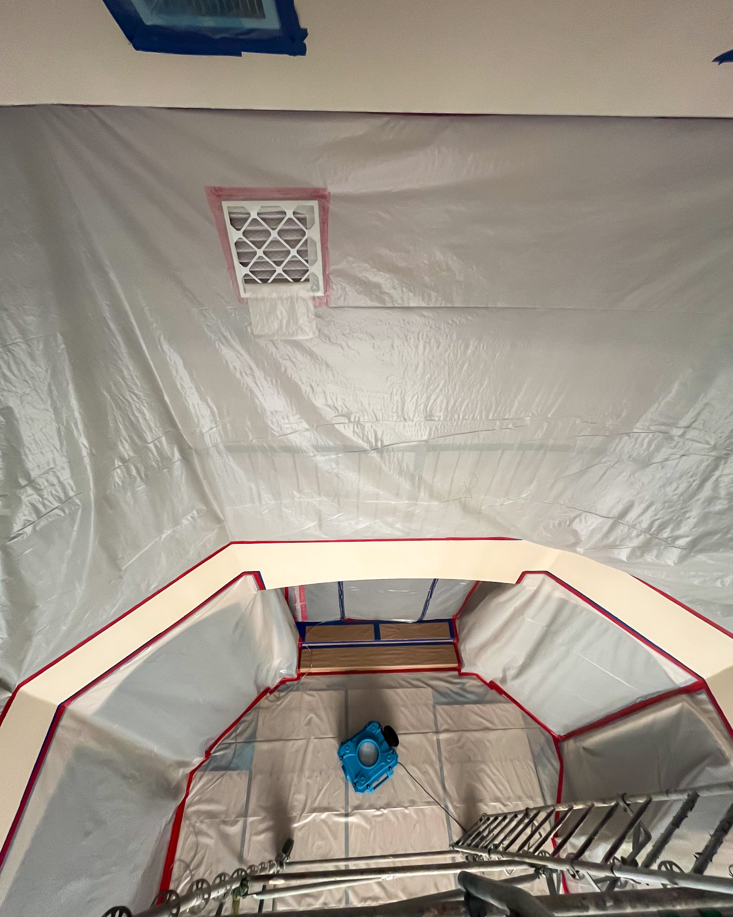 Overhead view into containment tent with air mover during catastrophe response