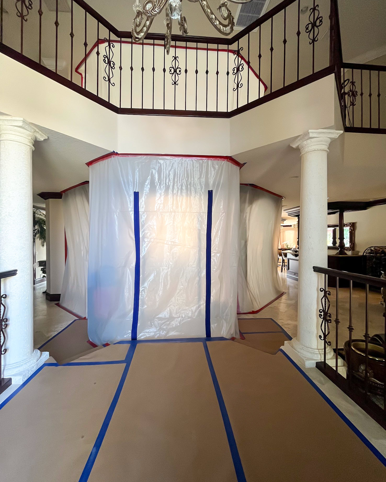 Full containment setup in grand luxury home foyer — catastrophe response in action