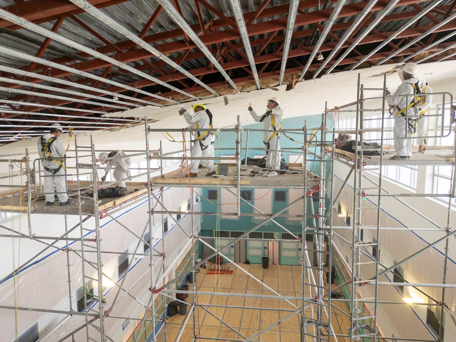 Elevated view of a large loss with crews working across a commercial interior