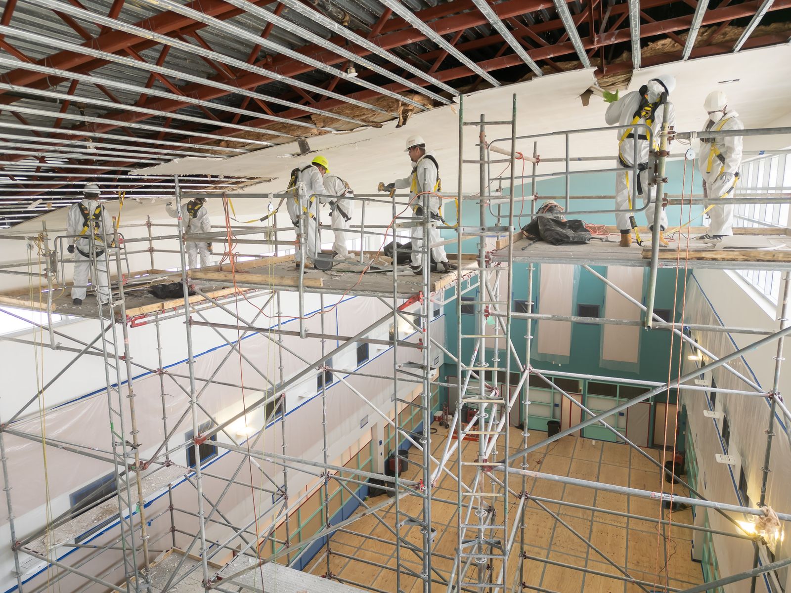 Scaffolding and crew working through a large commercial interior loss