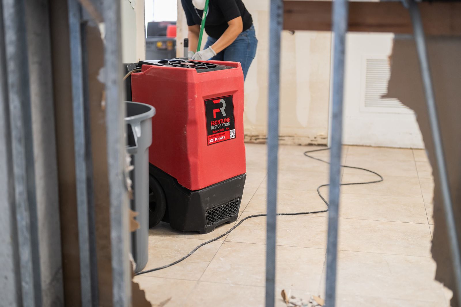 Dehumidifier running in a room stripped back to the studs