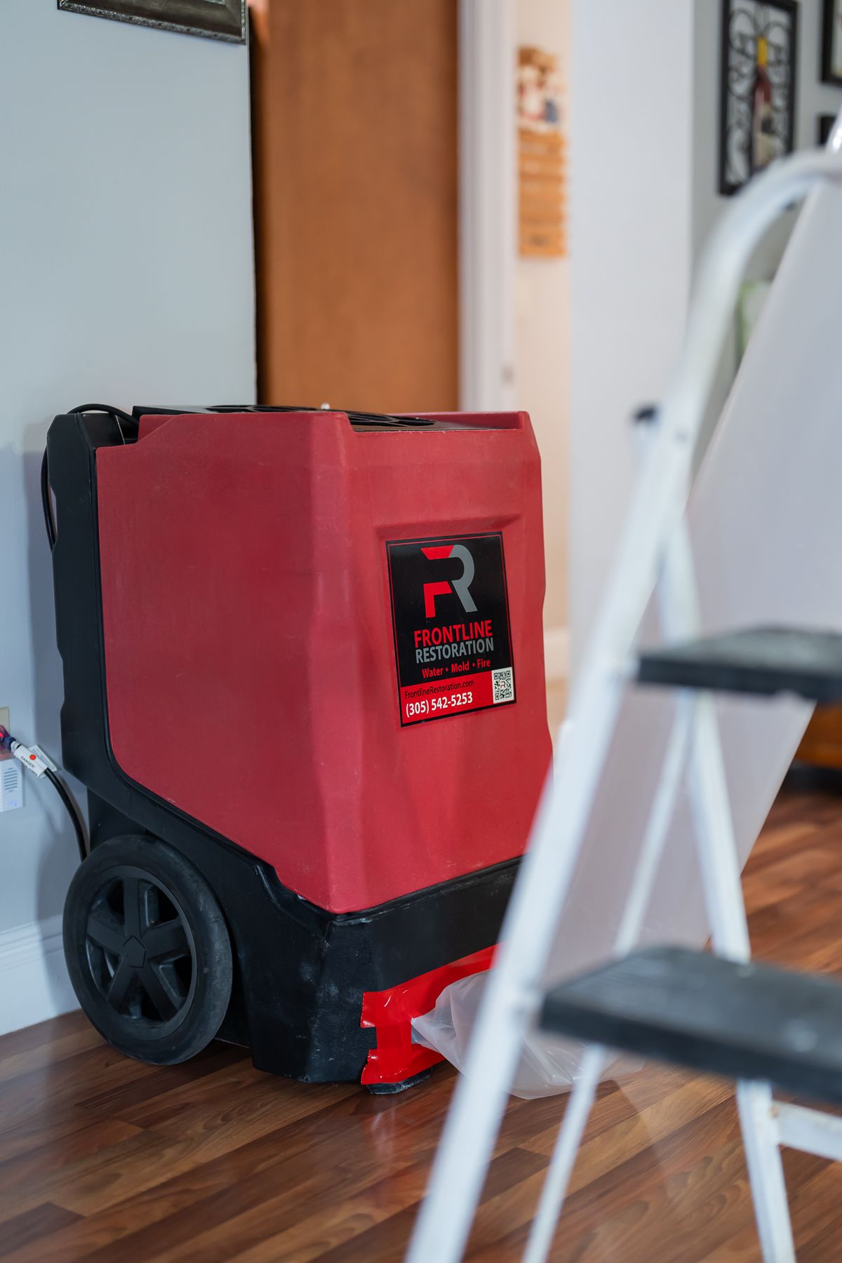 Commercial dehumidifier running during the structural drying phase