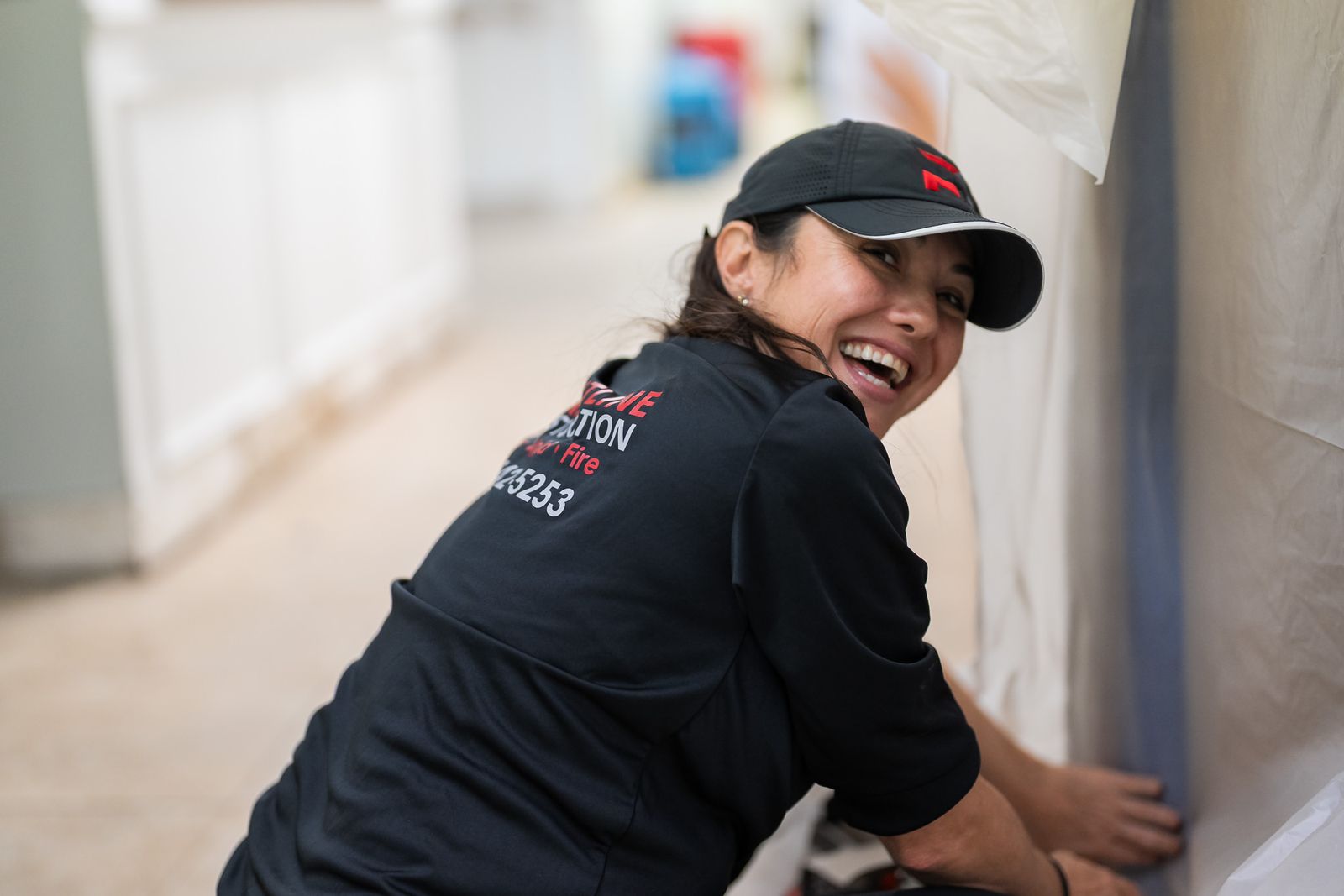 Technician sealing containment in a commercial interior